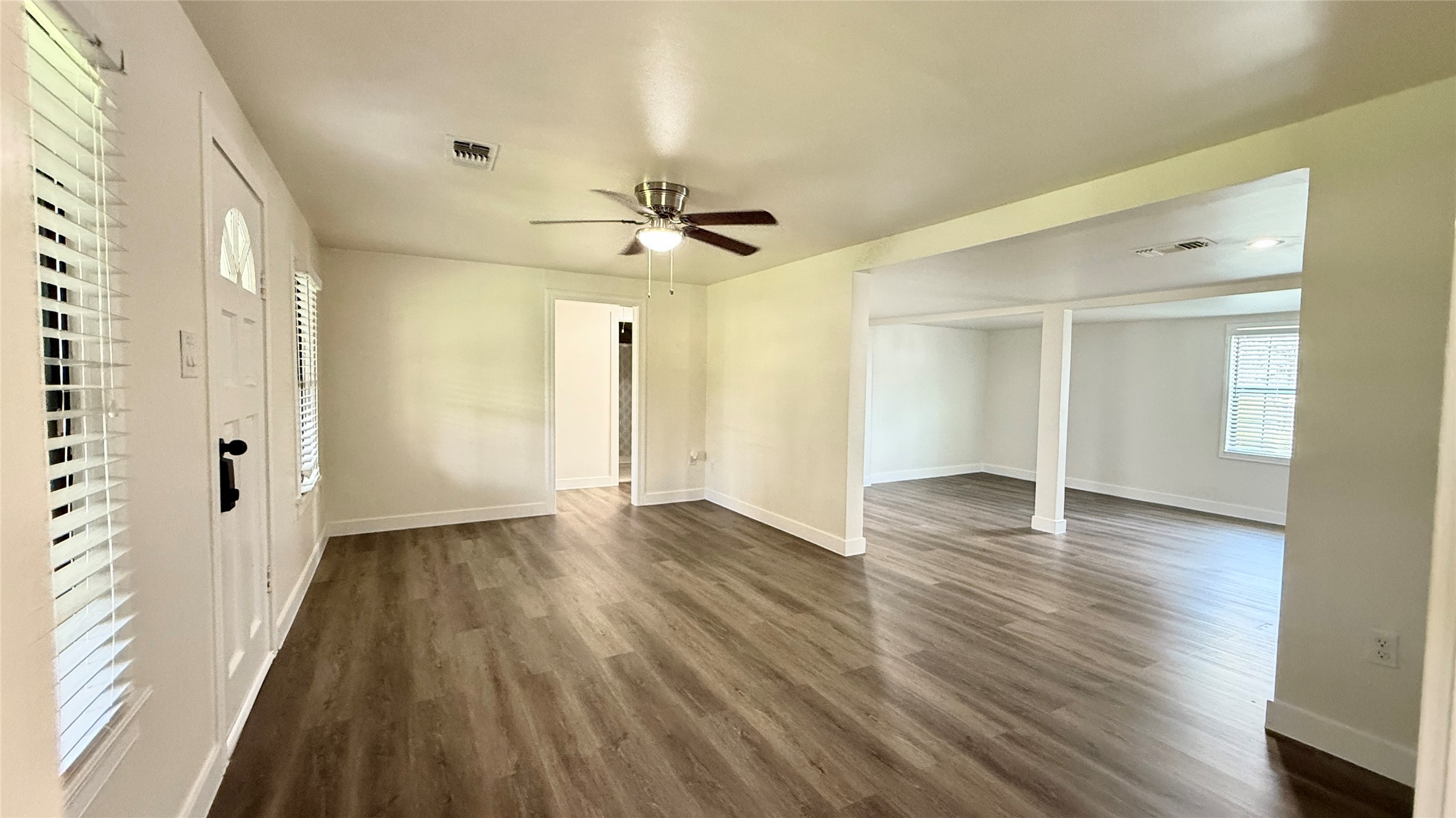 13309 Farm To Market 359 Hempstead, TX 77445 - Photo 18 of 34 a view of an empty room with wooden floor and a window