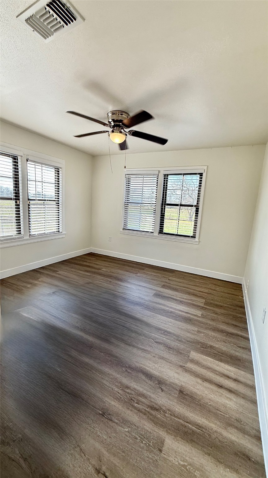 13309 Farm To Market 359 Hempstead, TX 77445 - Photo 20 of 34 a view of an empty room with wooden floor and a window