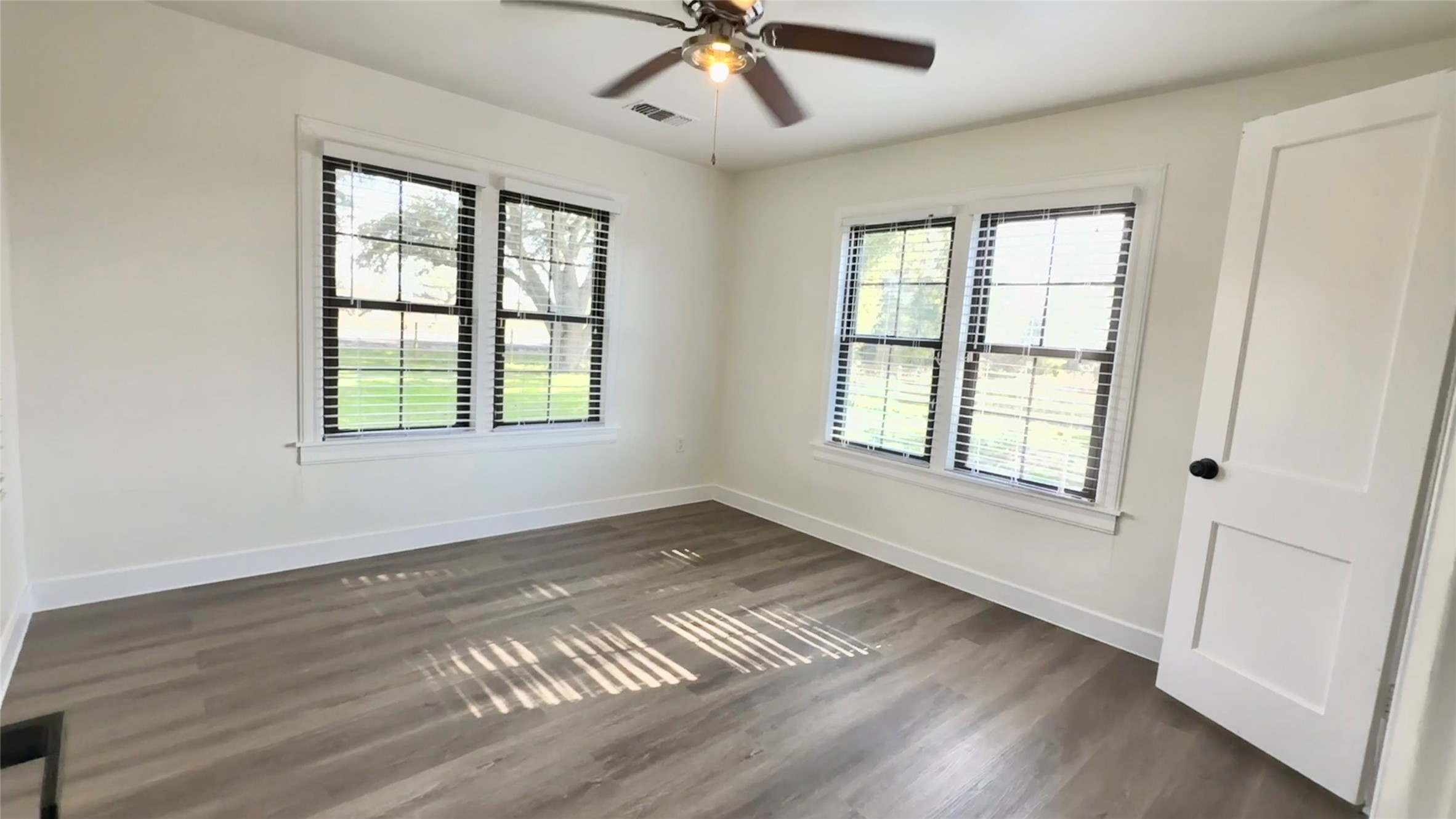 13309 Farm To Market 359 Hempstead, TX 77445 - Photo 29 of 34 a view of an empty room with wooden floor and a window