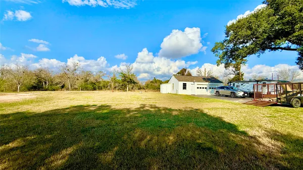 a view of swimming pool with outdoor seating