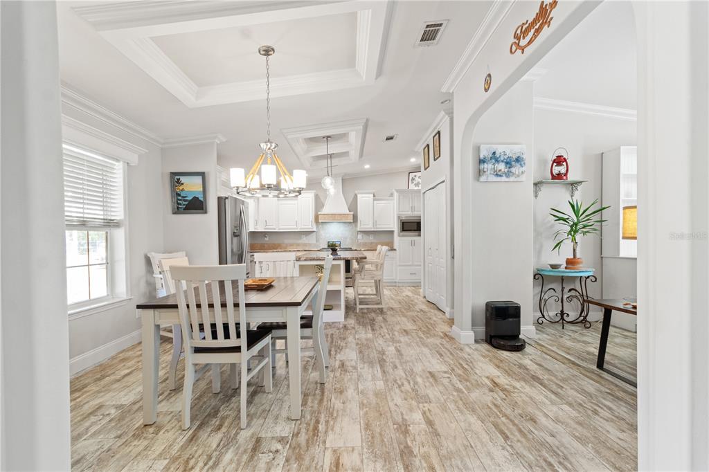 9410 Southwest 156th Place Dunnellon, FL 34432 - Photo 11 of 56 a view of a dining room with furniture window and wooden floor