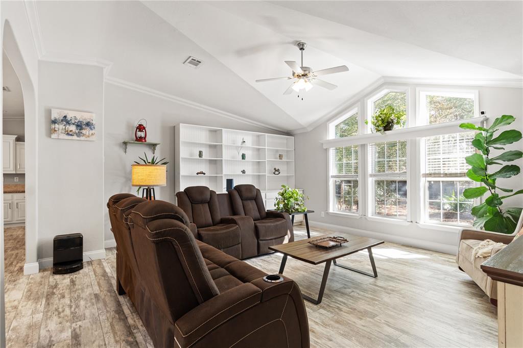 9410 Southwest 156th Place Dunnellon, FL 34432 - Photo 12 of 56 a living room with furniture a chandelier and a window