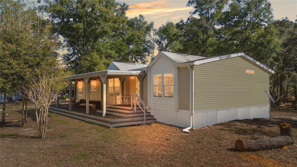 9410 Southwest 156th Place Dunnellon, FL 34432 - Photo 2 of 56 a front view of a house with a garage