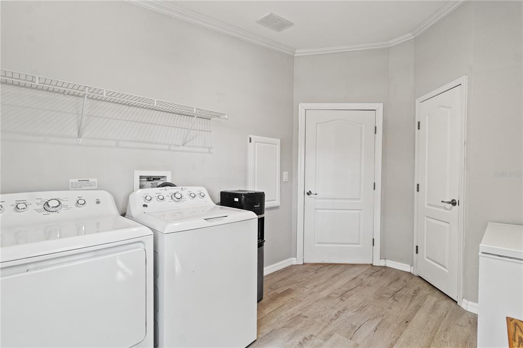 9410 Southwest 156th Place Dunnellon, FL 34432 - Photo 30 of 56 a view of storage and utility room with washer and dryer