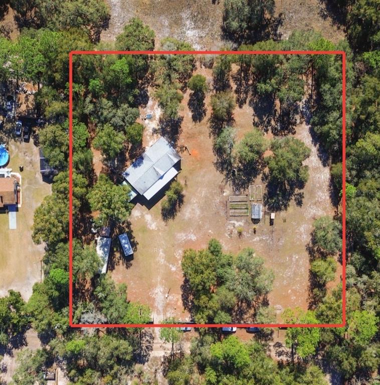 9410 Southwest 156th Place Dunnellon, FL 34432 - Photo 3 of 56 an aerial view of residential house with outdoor space and trees all around