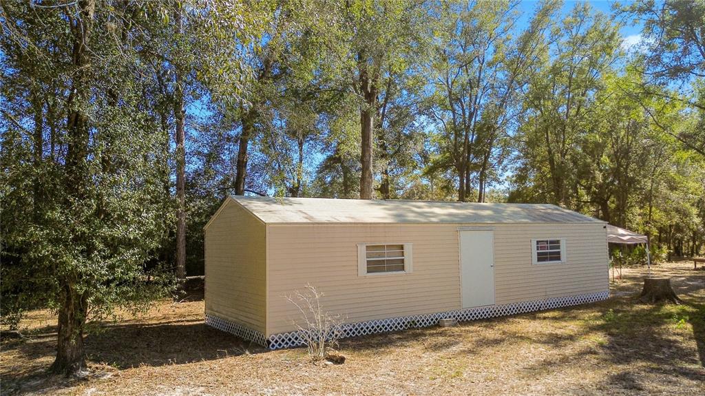 9410 Southwest 156th Place Dunnellon, FL 34432 - Photo 35 of 56 a view of a house with a tree