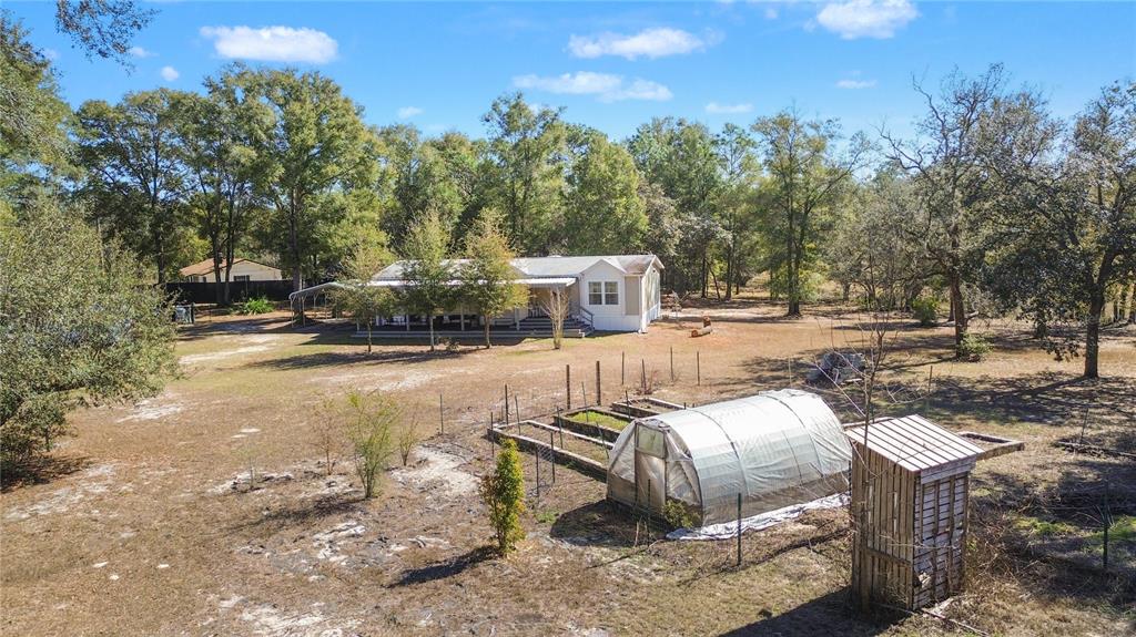 9410 Southwest 156th Place Dunnellon, FL 34432 - Photo 41 of 56 a view of a backyard with sitting area