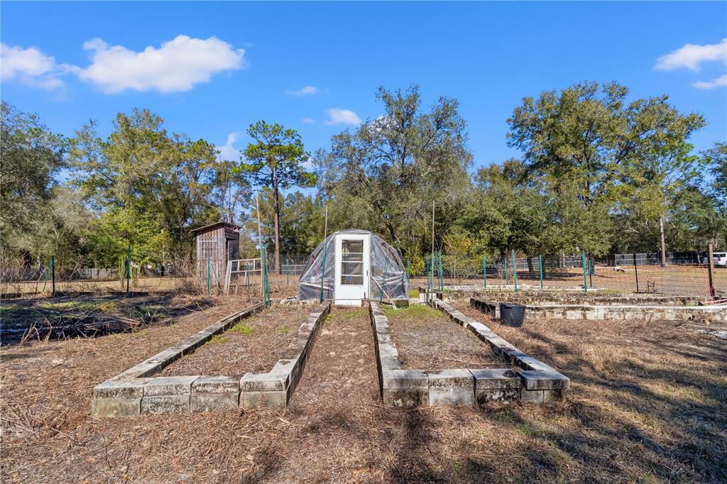 9410 Southwest 156th Place Dunnellon, FL 34432 - Photo 55 of 56 a view of a house with a yard