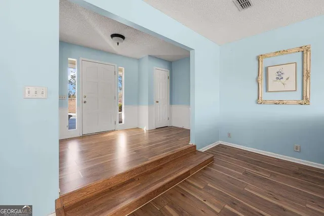 a kitchen with stainless steel appliances granite countertop a stove and a refrigerator