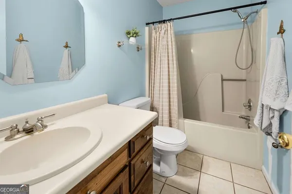 a bedroom with a bed and a table