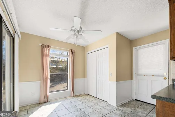 a living room with stainless steel appliances kitchen island granite countertop furniture and a kitchen view