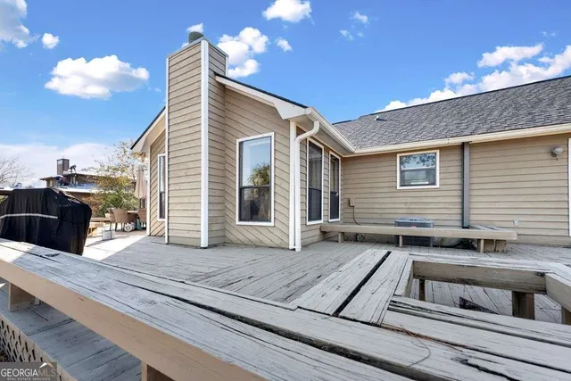 a view of a house with a roof deck