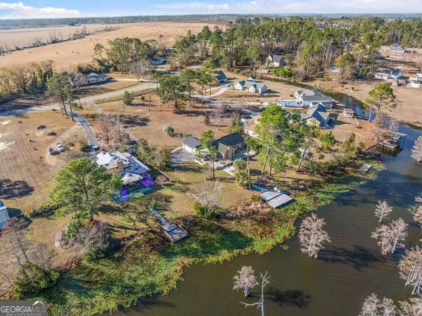a aerial view of a house with a yard
