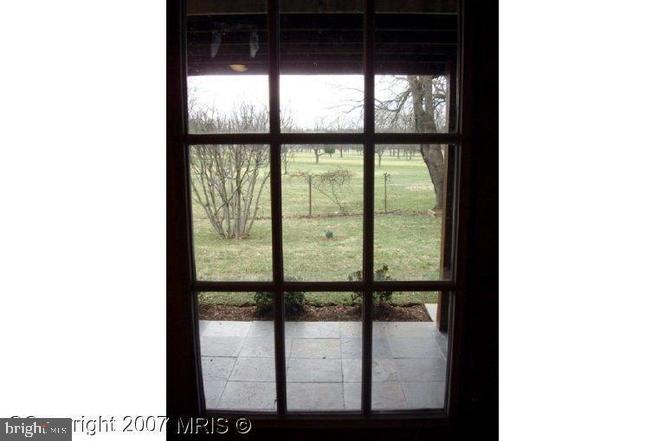 304 Old Courthouse Road Northeast Vienna, VA 22180 - Photo 15 of 25 Serene view through rustic panes.