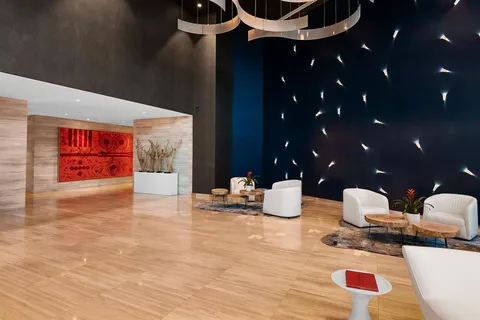 a lobby with furniture and window