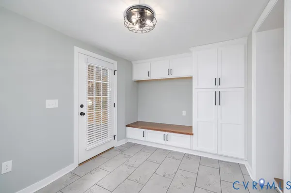 a view of an empty room with a window
