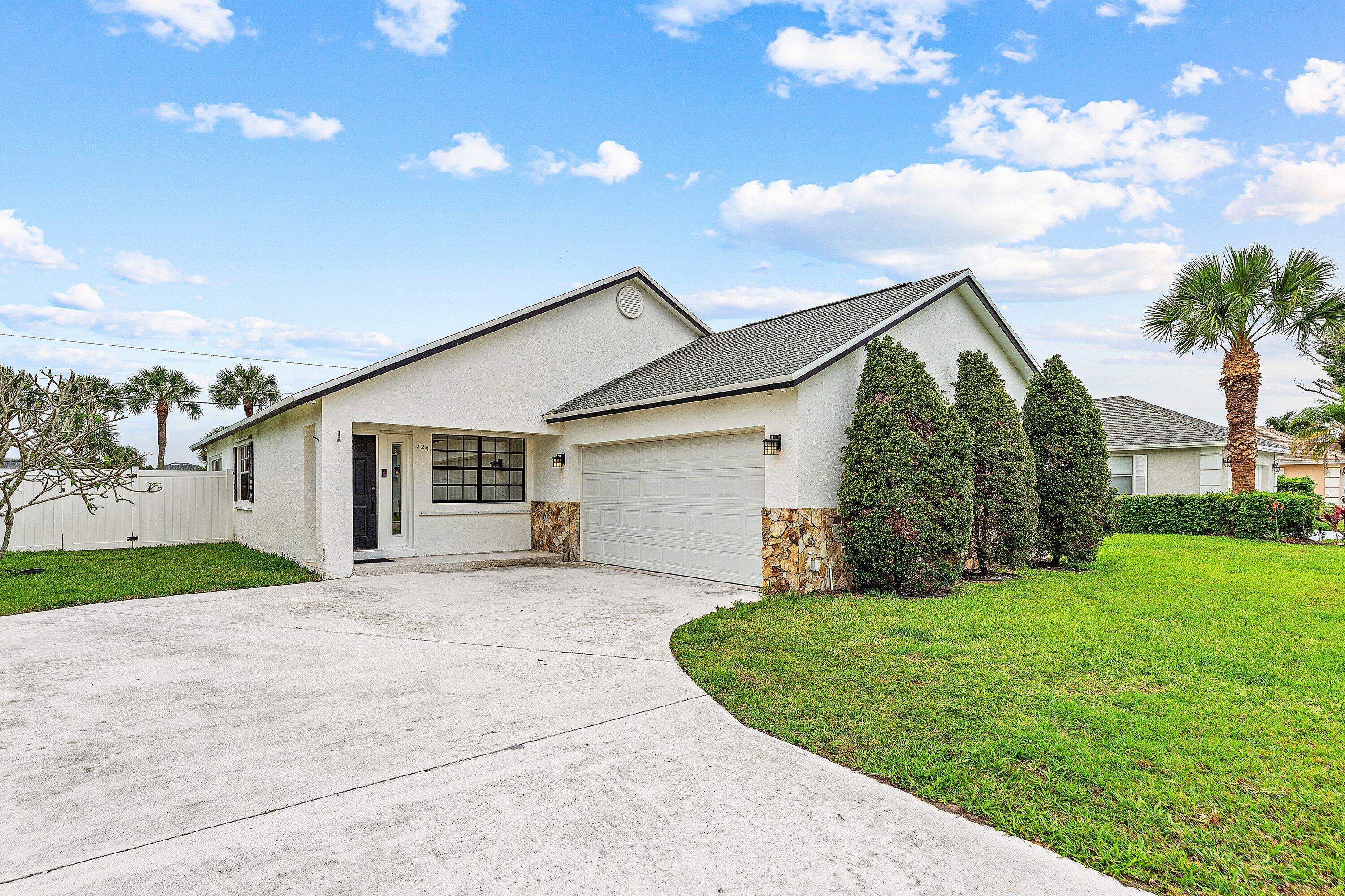 125 Raintree Trail Jupiter, FL 33458 - Photo 1 of 46 001-125RaintreeTrail-Jupiter-FL-33458-SM