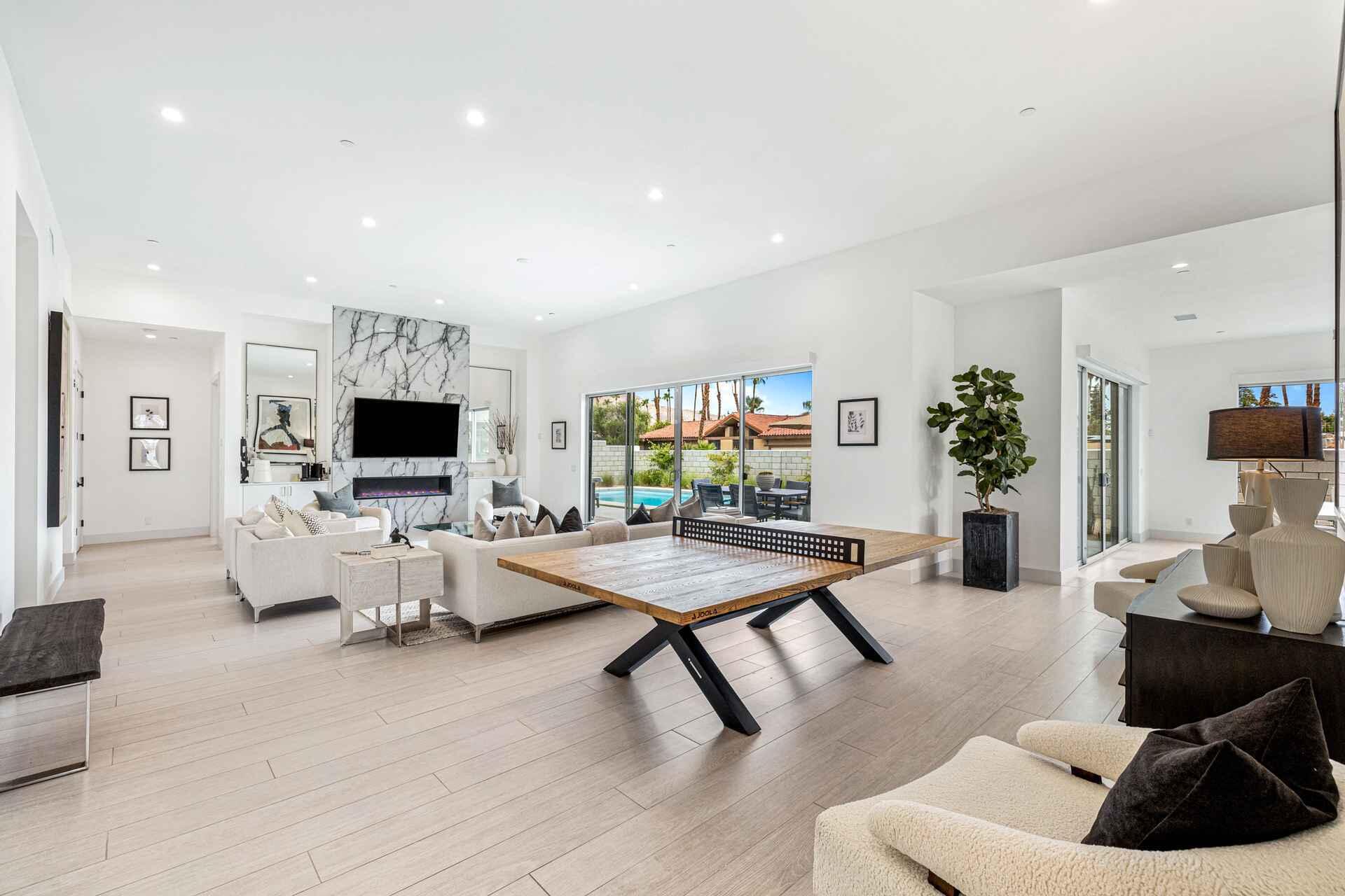 72985 Somera Road Palm Desert, CA 92260 - Photo 11 of 33 a living room with furniture and a flat screen tv