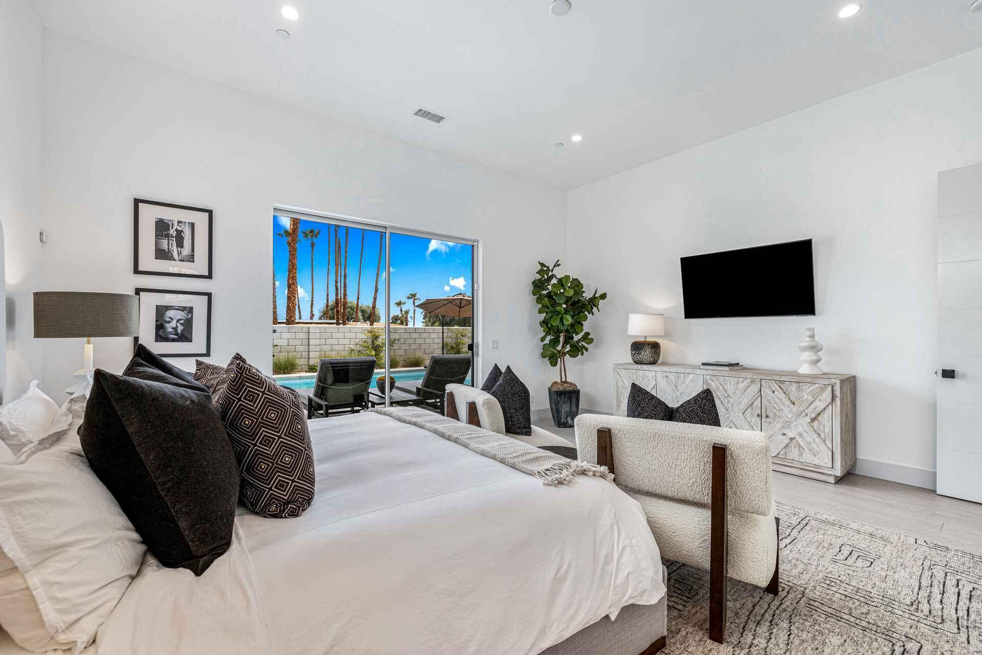 72985 Somera Road Palm Desert, CA 92260 - Photo 19 of 33 a bedroom with a bed and a flat screen tv