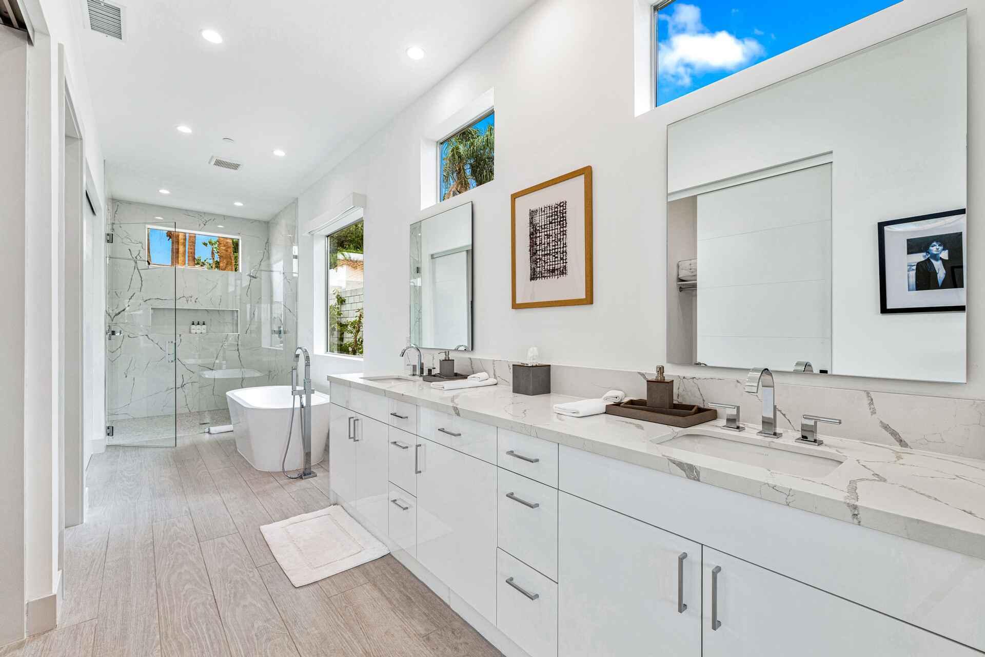 72985 Somera Road Palm Desert, CA 92260 - Photo 21 of 33 a spacious bathroom with double sink a toilet a shower and a mirror