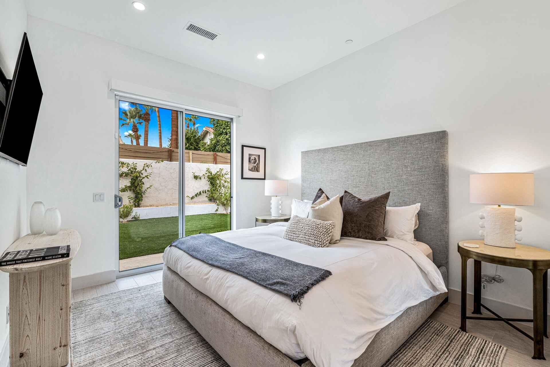 72985 Somera Road Palm Desert, CA 92260 - Photo 25 of 33 a bedroom with a large bed and a tv