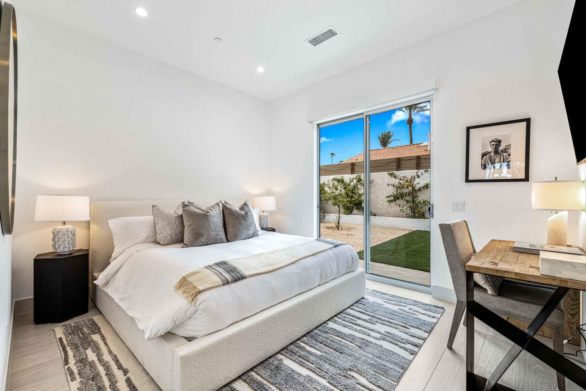 72985 Somera Road Palm Desert, CA 92260 - Photo 27 of 33 a bedroom with a bed and a desk