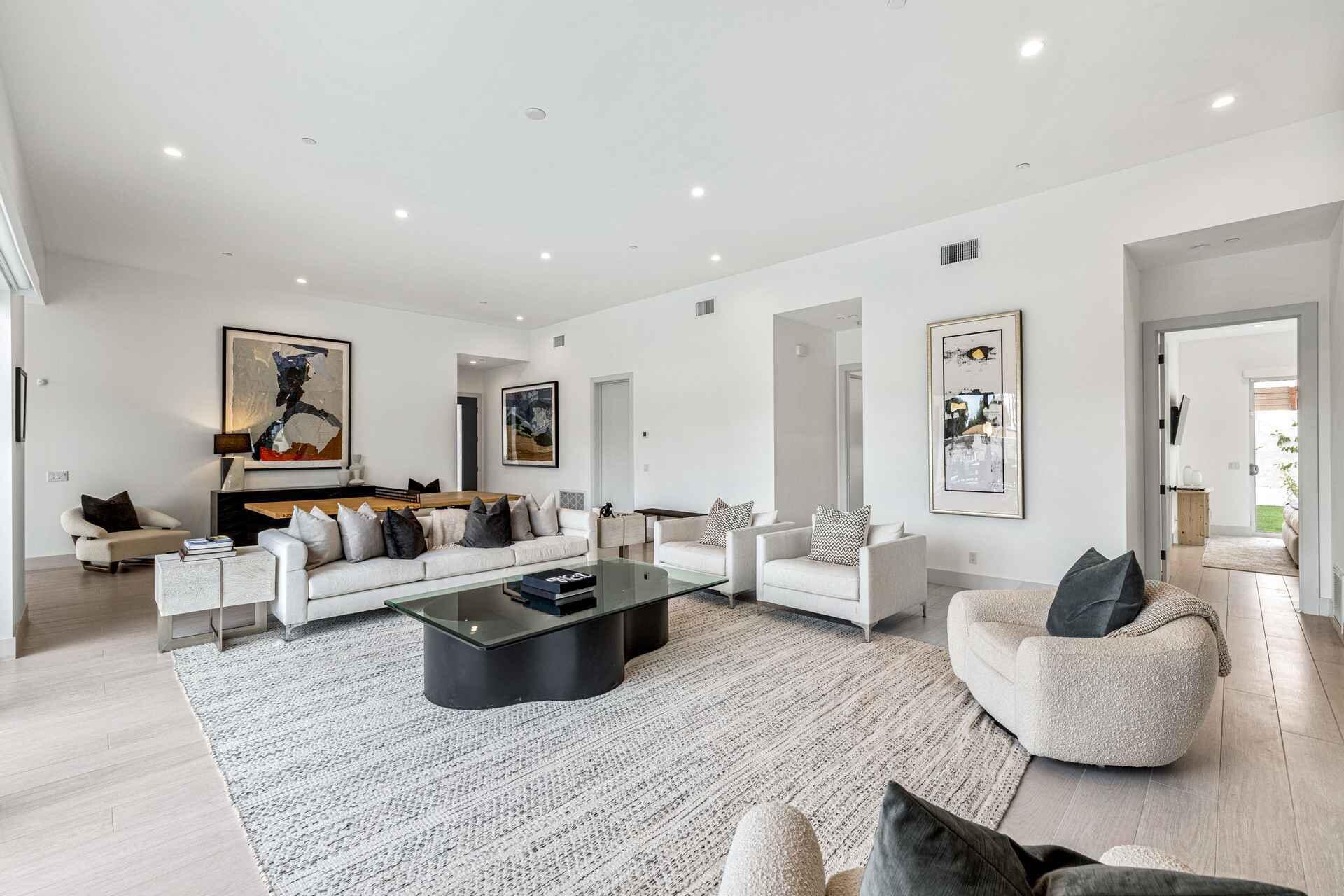 72985 Somera Road Palm Desert, CA 92260 - Photo 9 of 33 a living room with furniture and wooden floor