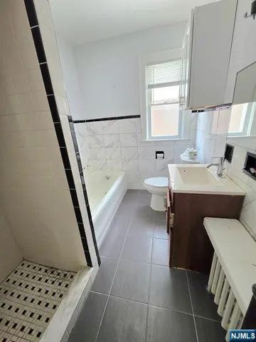 a room with a washing machine and sink