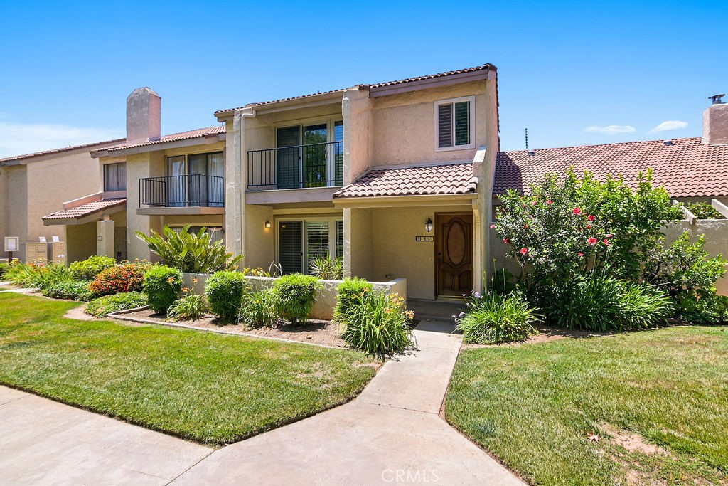 7046 Poco Senda Riverside, CA 92504 - Photo 1 of 1 a front view of a house with a yard