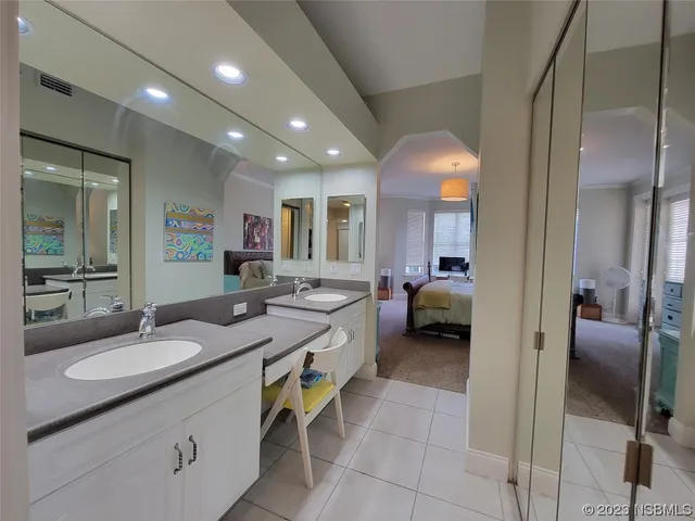 a bedroom with furniture and a baby crib