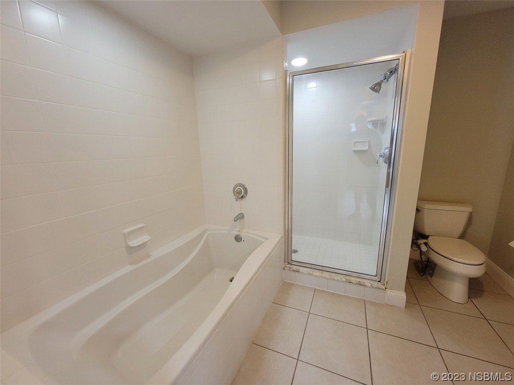 4623 Rivers Edge Village Lane, Unit 6204 Ponce Inlet, FL 32127 - Photo 14 of 62 a spacious bathroom with a granite countertop toilet a sink and shower