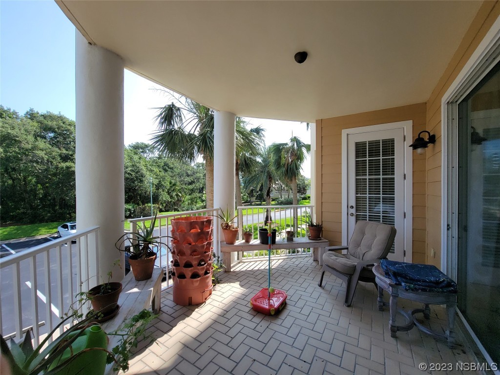 4623 Rivers Edge Village Lane, Unit 6204 Ponce Inlet, FL 32127 - Photo 20 of 62 a living room filled with furniture