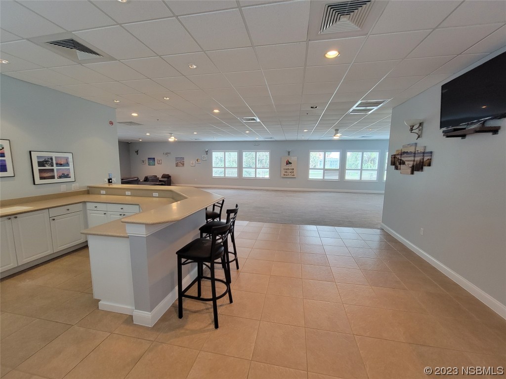 4623 Rivers Edge Village Lane, Unit 6204 Ponce Inlet, FL 32127 - Photo 30 of 62 a kitchen with a sink cabinets and window