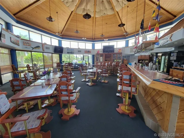 a outdoor dining space with furniture and a view of lake