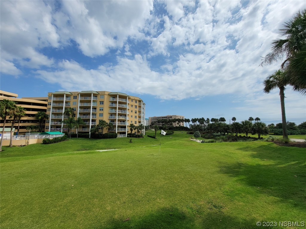 4623 Rivers Edge Village Lane, Unit 6204 Ponce Inlet, FL 32127 - Photo 43 of 62 a view of a garden and basketball court