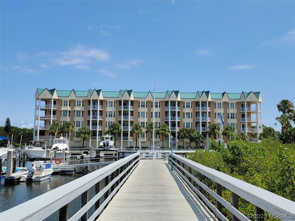 4623 Rivers Edge Village Lane, Unit 6204 Ponce Inlet, FL 32127 - Photo 47 of 62 a view of balcony with a couple of cars parked in parking lot