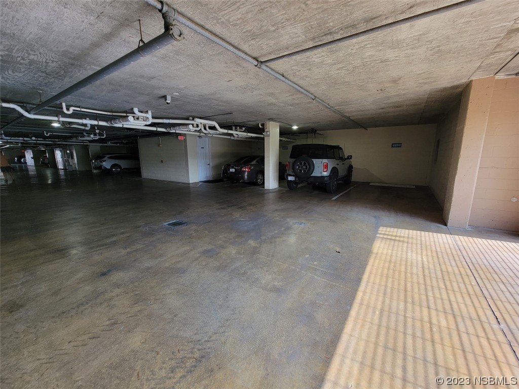 4623 Rivers Edge Village Lane, Unit 6204 Ponce Inlet, FL 32127 - Photo 59 of 62 a view of a garage