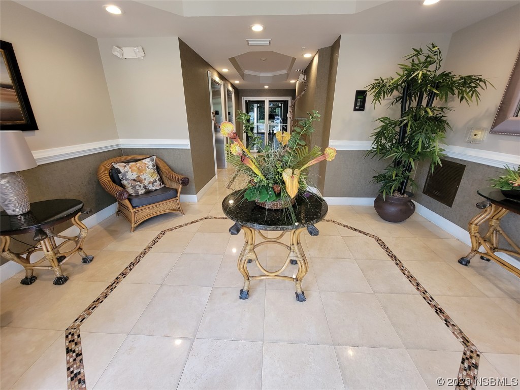 4623 Rivers Edge Village Lane, Unit 6204 Ponce Inlet, FL 32127 - Photo 60 of 62 a vase of flowers sitting on a table
