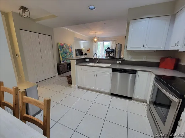 a spacious bathroom with a granite countertop toilet a sink and shower