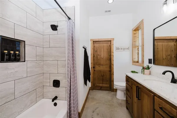 a bedroom with a bed and a desk