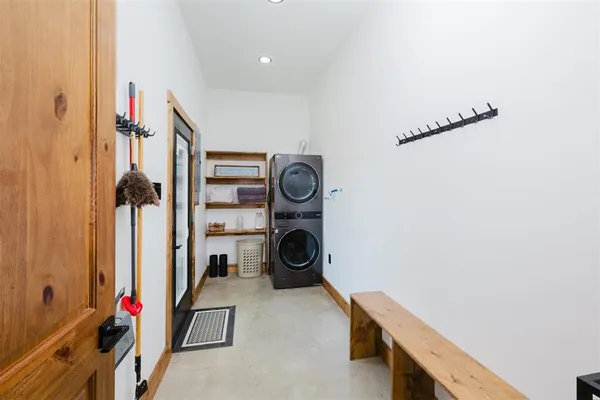 a dining table with chairs and window