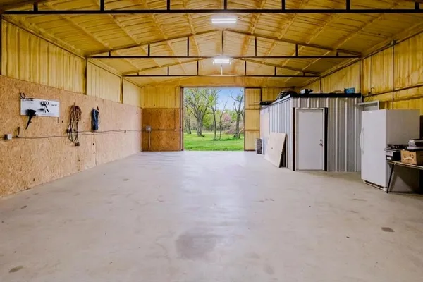 a large kitchen with a large window and stainless steel appliances