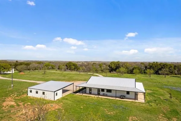 a view of a room with a garage and a table
