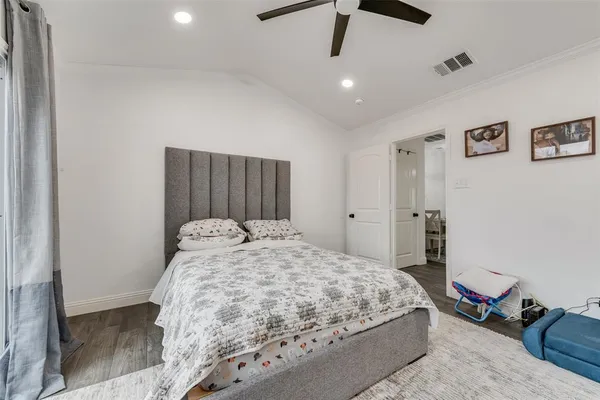 a bedroom with a bed and a dresser