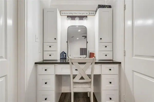 a view of cabinets a sink and a mirror