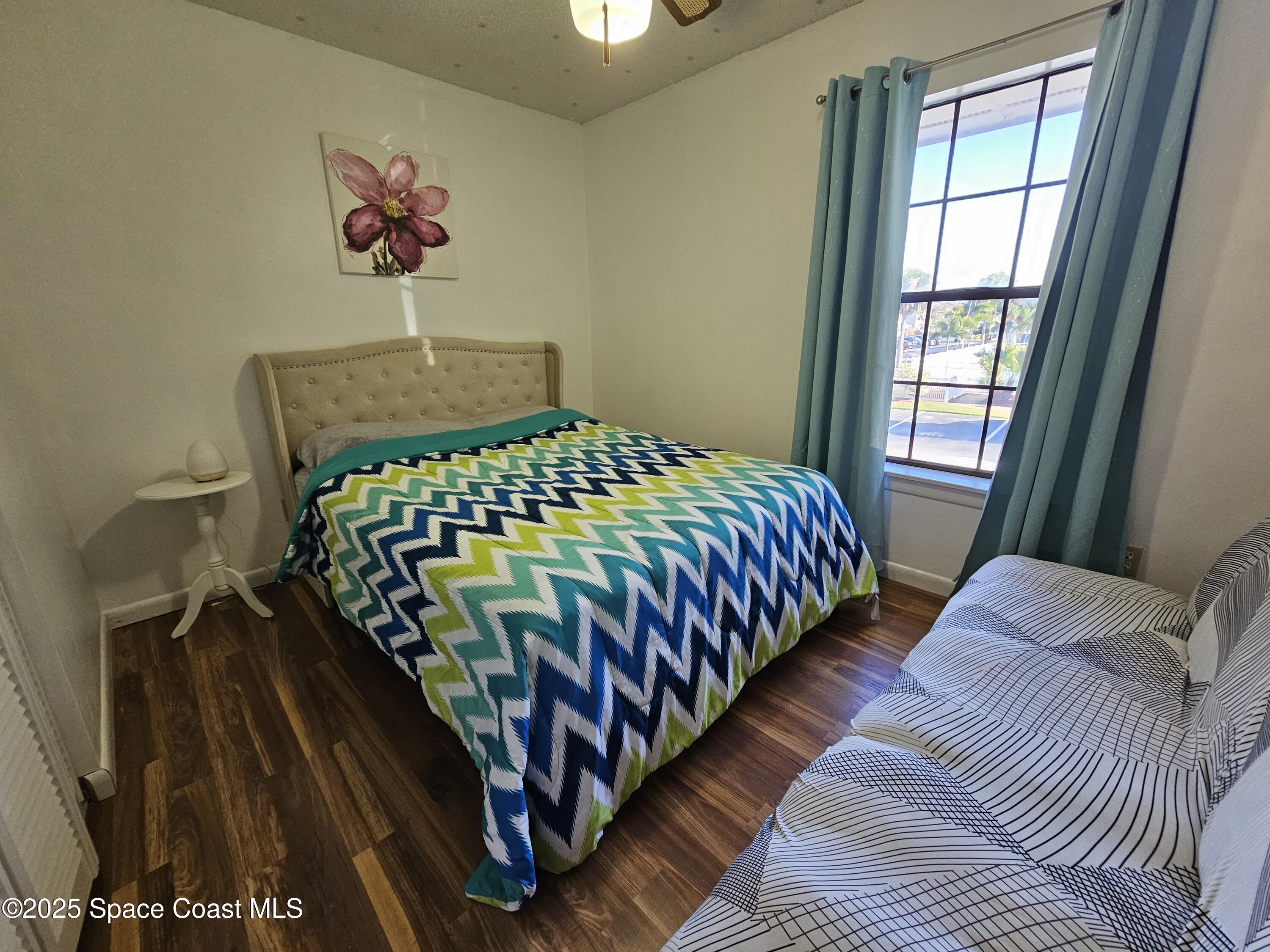 2314 Manor Drive Northeast Palm Bay, FL 32905 - Photo 14 of 23 a bedroom with bed and a window