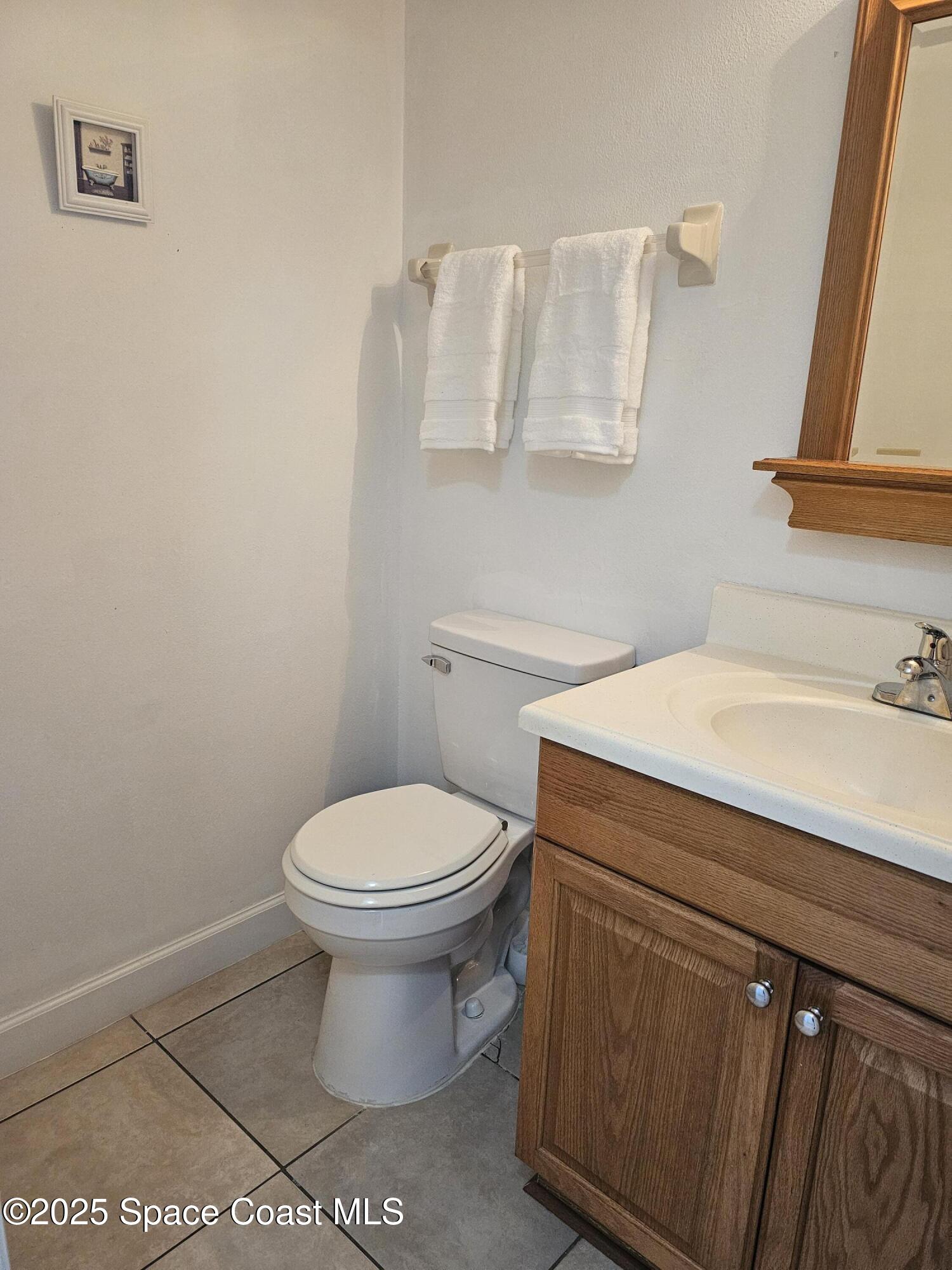 2314 Manor Drive Northeast Palm Bay, FL 32905 - Photo 10 of 23 a bathroom with a sink and a toilet