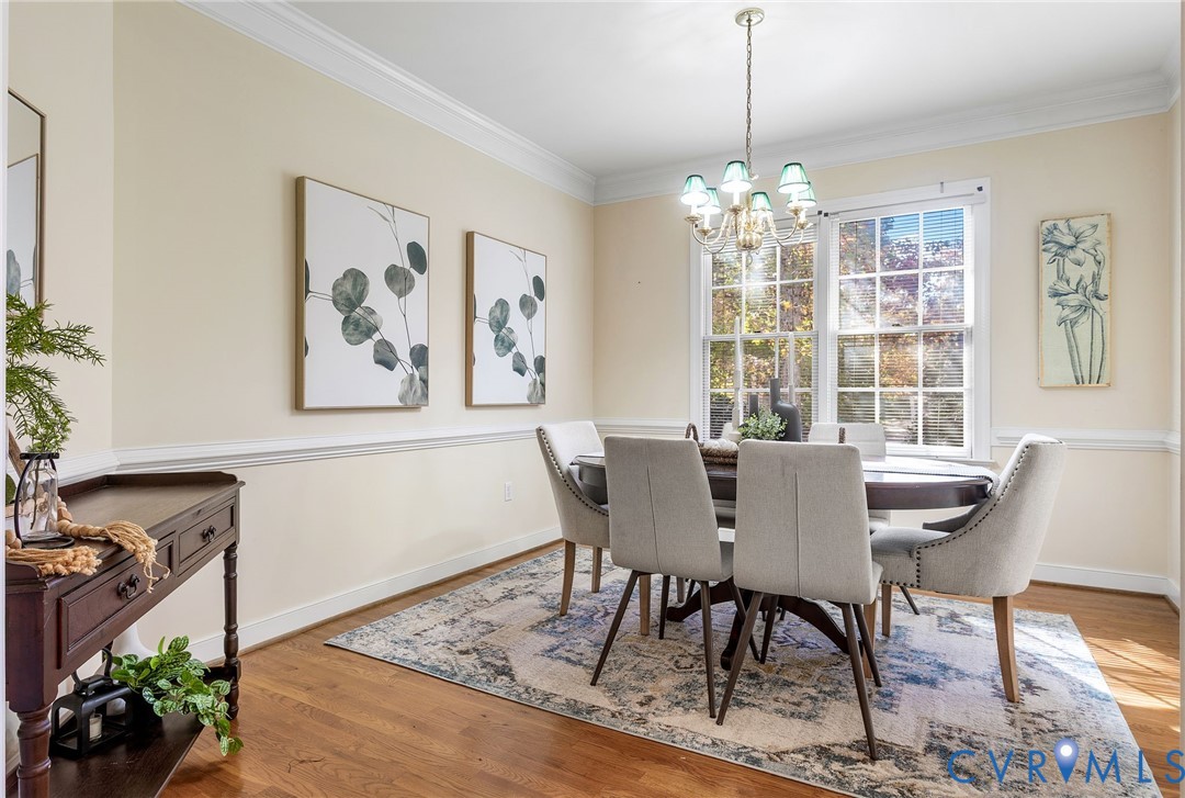 1608 Fairfield Green Road Henrico, VA 23238 - Photo 15 of 35 a view of a dining room with furniture window and wooden floor