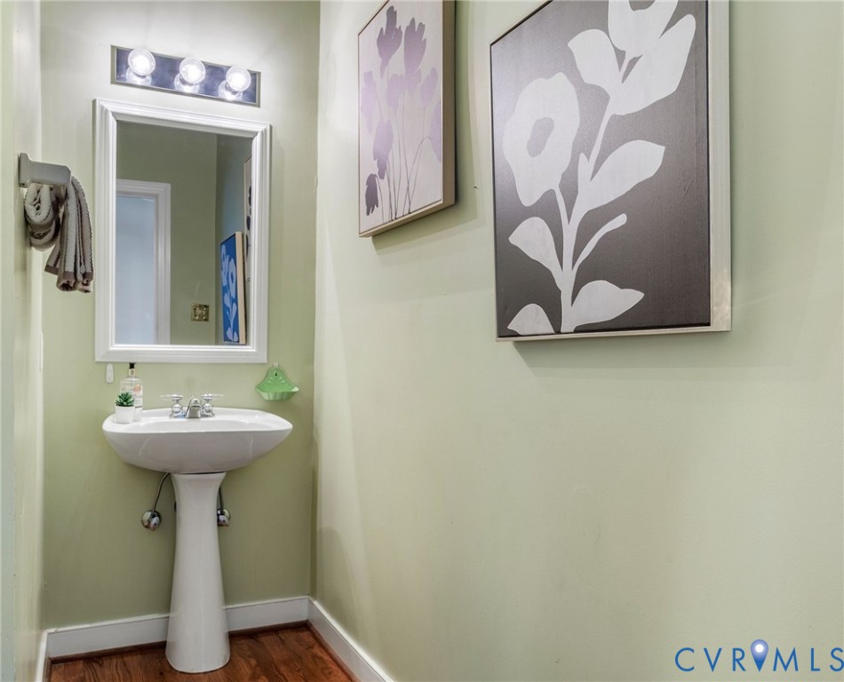 1608 Fairfield Green Road Henrico, VA 23238 - Photo 18 of 35 a bathroom with a sink and mirror