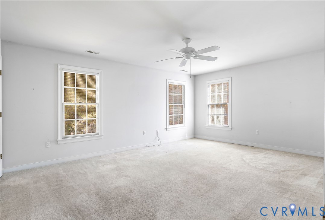 1608 Fairfield Green Road Henrico, VA 23238 - Photo 25 of 35 an empty room with windows and ceiling fan